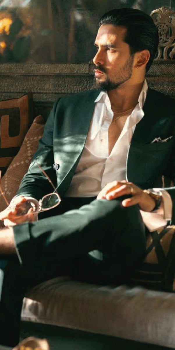 Lapeless dark green suit